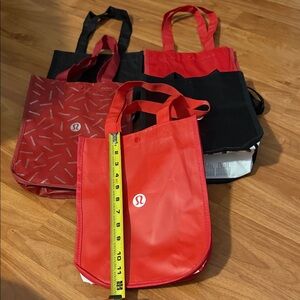 Lululemon Athletica Red and Black Tote Bags